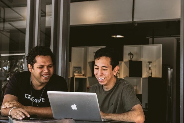 Two men discussing how to market their startups