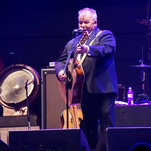 Photograph of musican John Prine Time in concert.