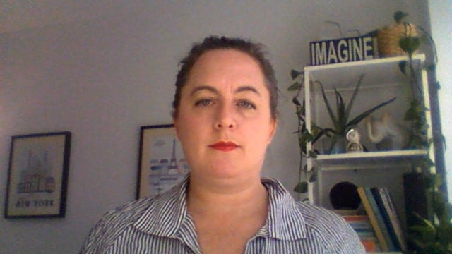 Person logging into video call with good lighting and interesting background