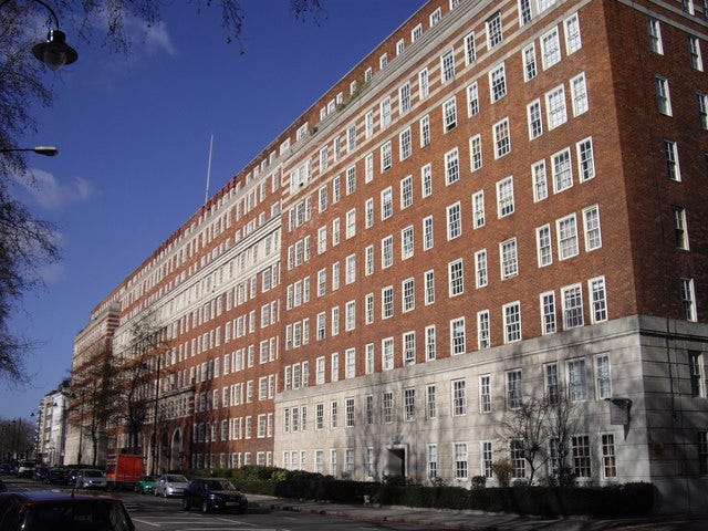 A very large, mostly brick building. Approximately 9 stories. It is called ‘Dolphin Square’