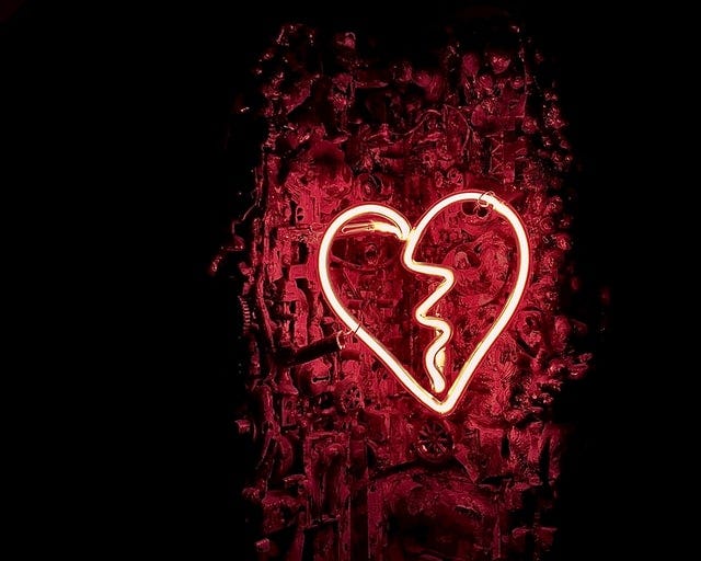 a red glowing broken heart.