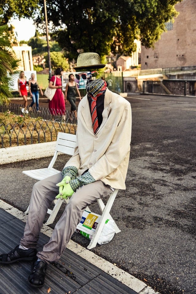 A ghost sits on a park bench.