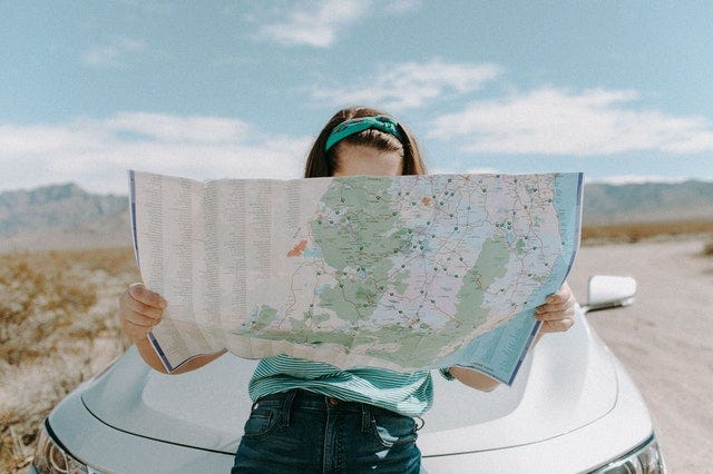woman reading a map
