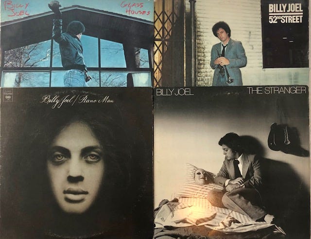 Four album covers of Billy Joel’s taken by author