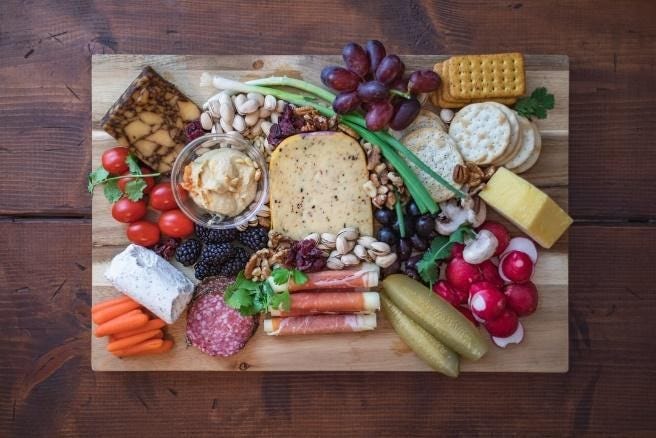 best keto diet snacks Charcuterie board for a party — but why not make a smaller one for a snack tray?