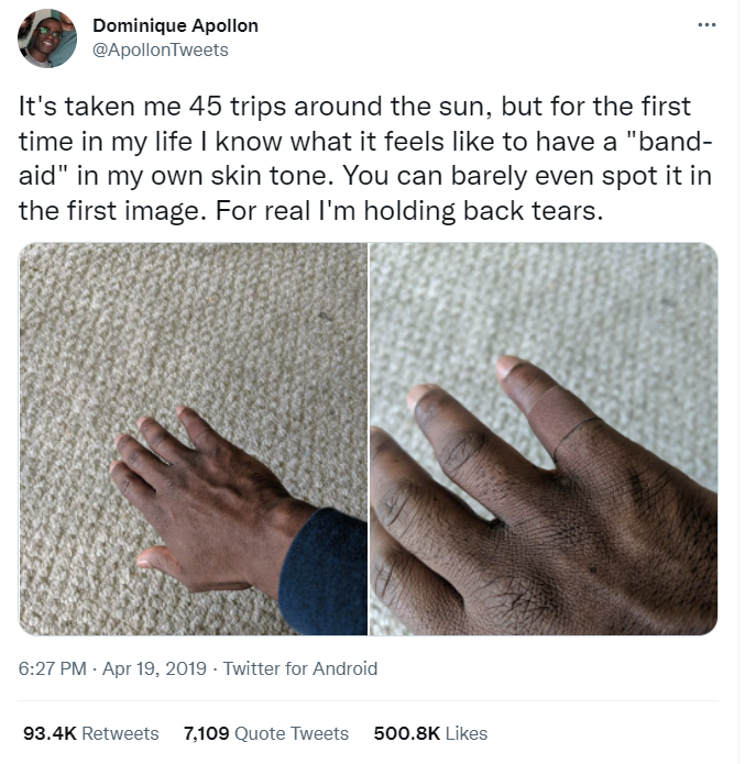 Tweet: “It’s taken me 45 trips around the sun, but for the first time in my life I know what it feels like to have a “band-aid” in my own skin tone. You can barely even spot it in the first image. For real I’m holding back tears.” Image: hand of a dark-skinned person with a brown band-aid