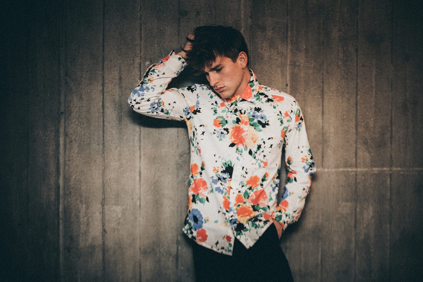 A white guy wearing a slightly gay-looking floral shirt, which I assume makes him a hero to everyone looking at this picture.