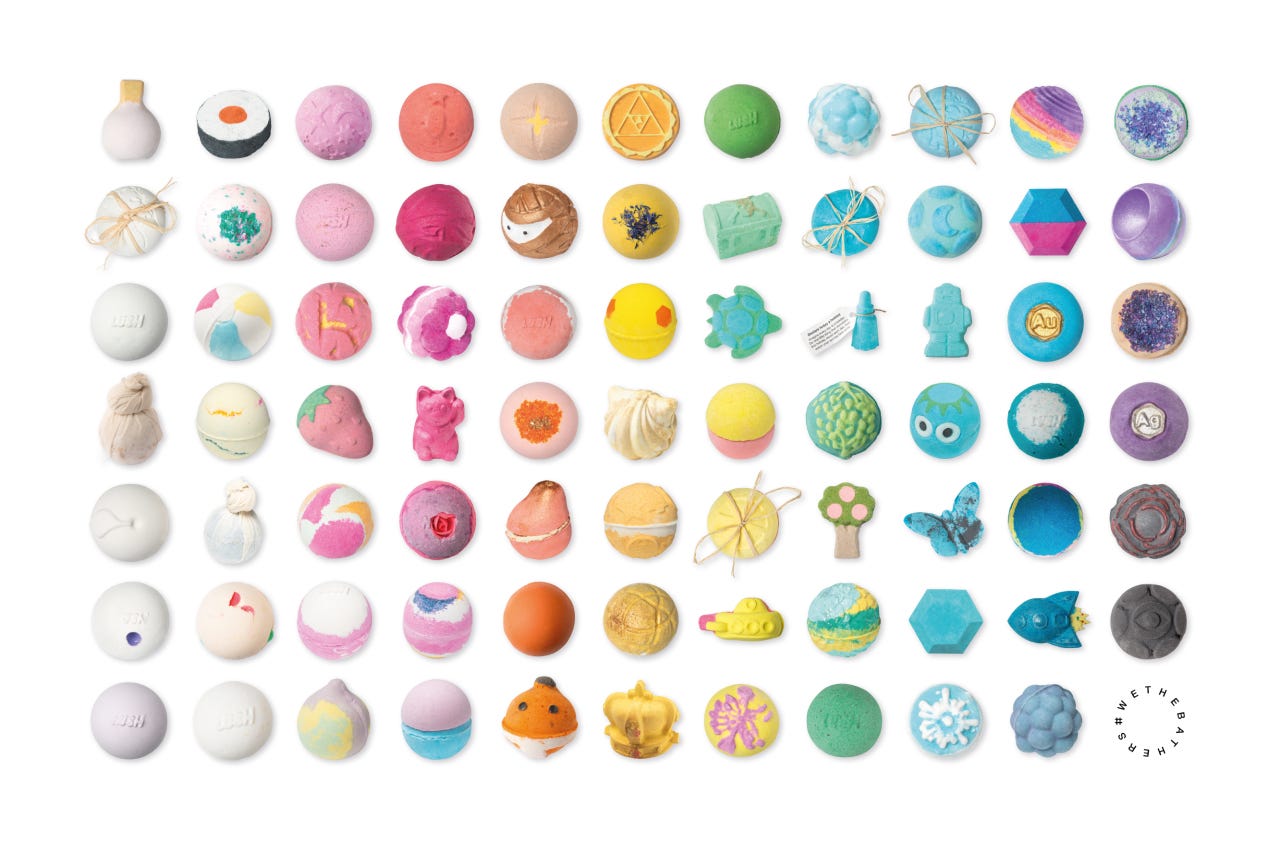 Rows of Lush bath bombs sorted by color