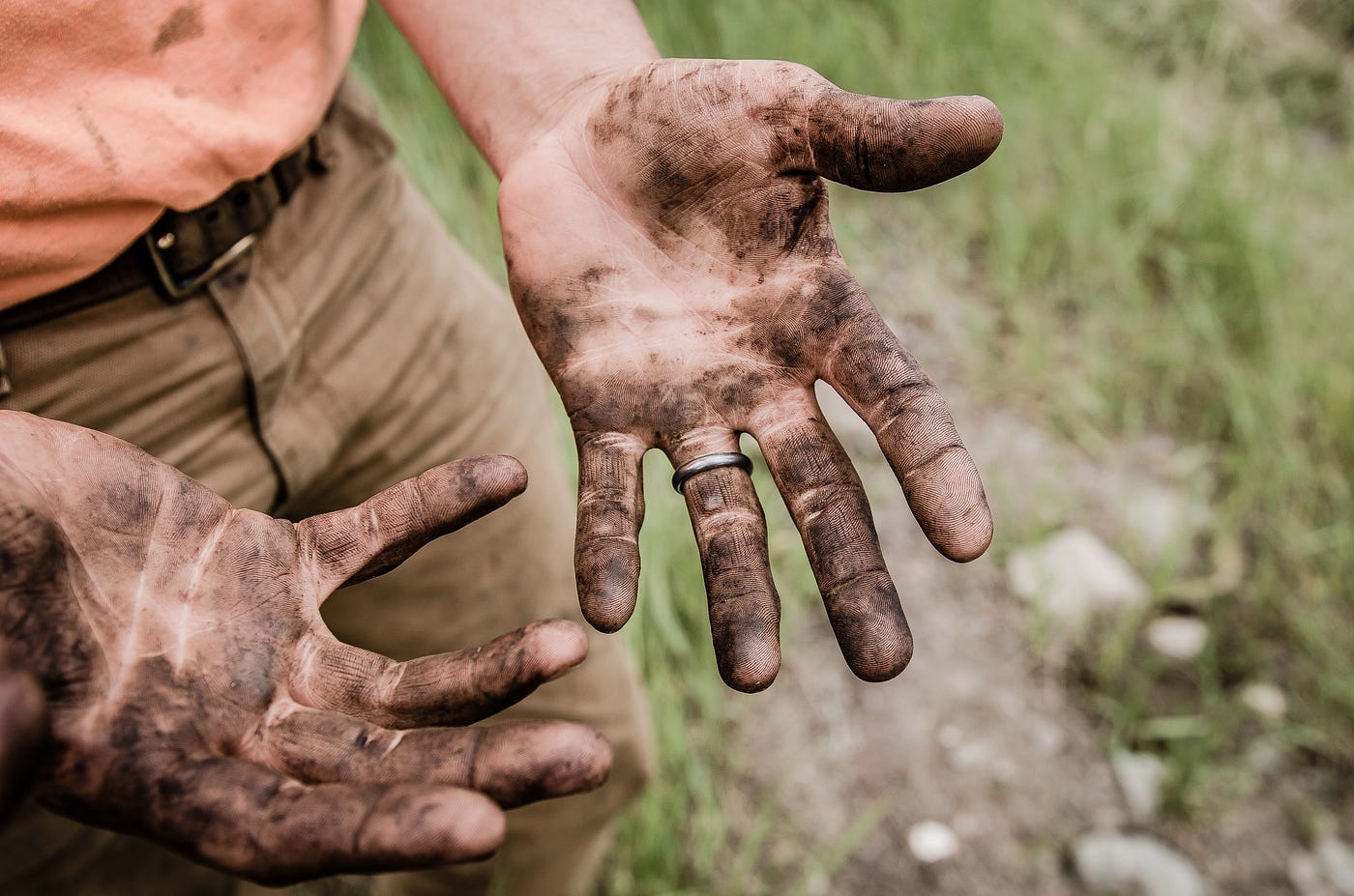 A man with dirty hands.