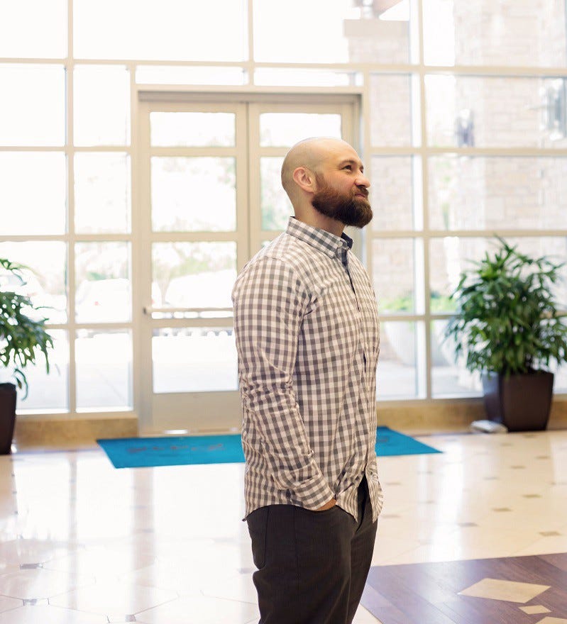Kris Rivenburgh standing in business center lobby.