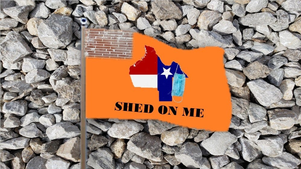An orange flag on a bed of rocks, with a canton of bricks, shows Texas upside down with a dangling mask, and the motto Shed on Me.