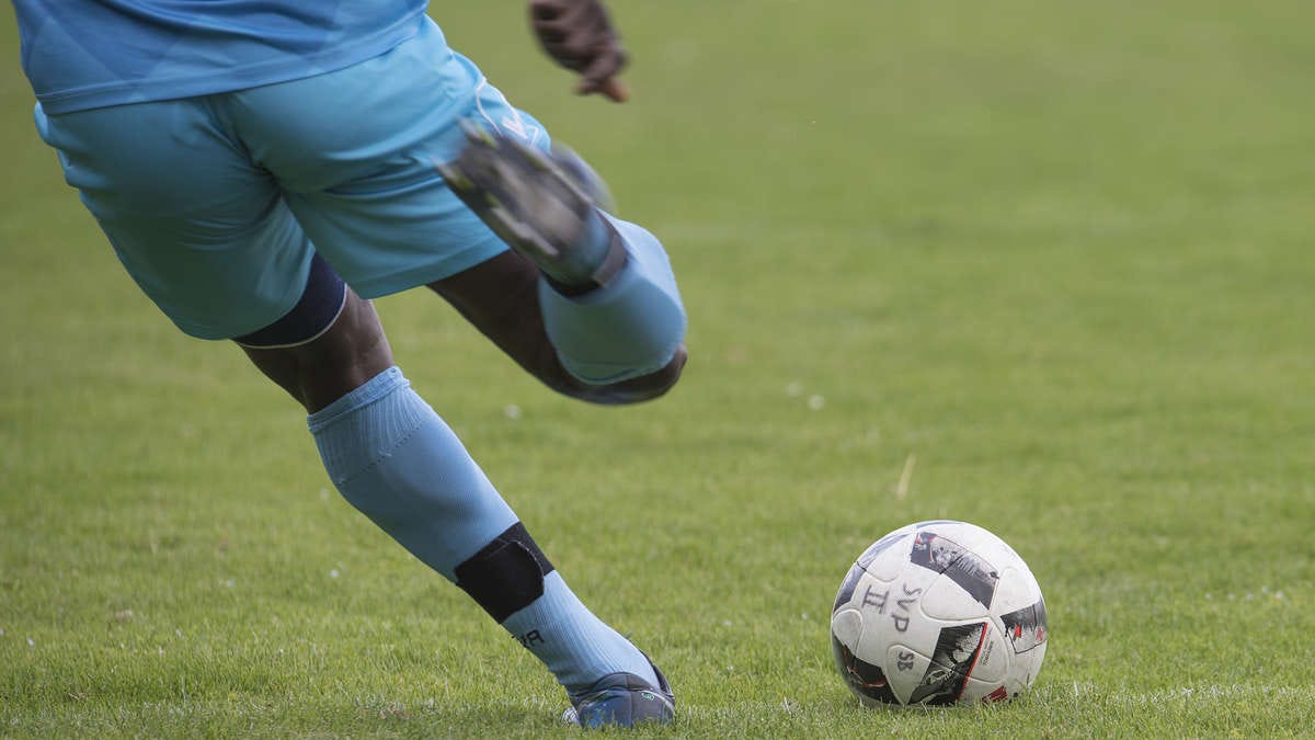 man playing a football 