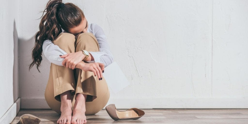 Women who looks very down about her job, feeling like a fraud