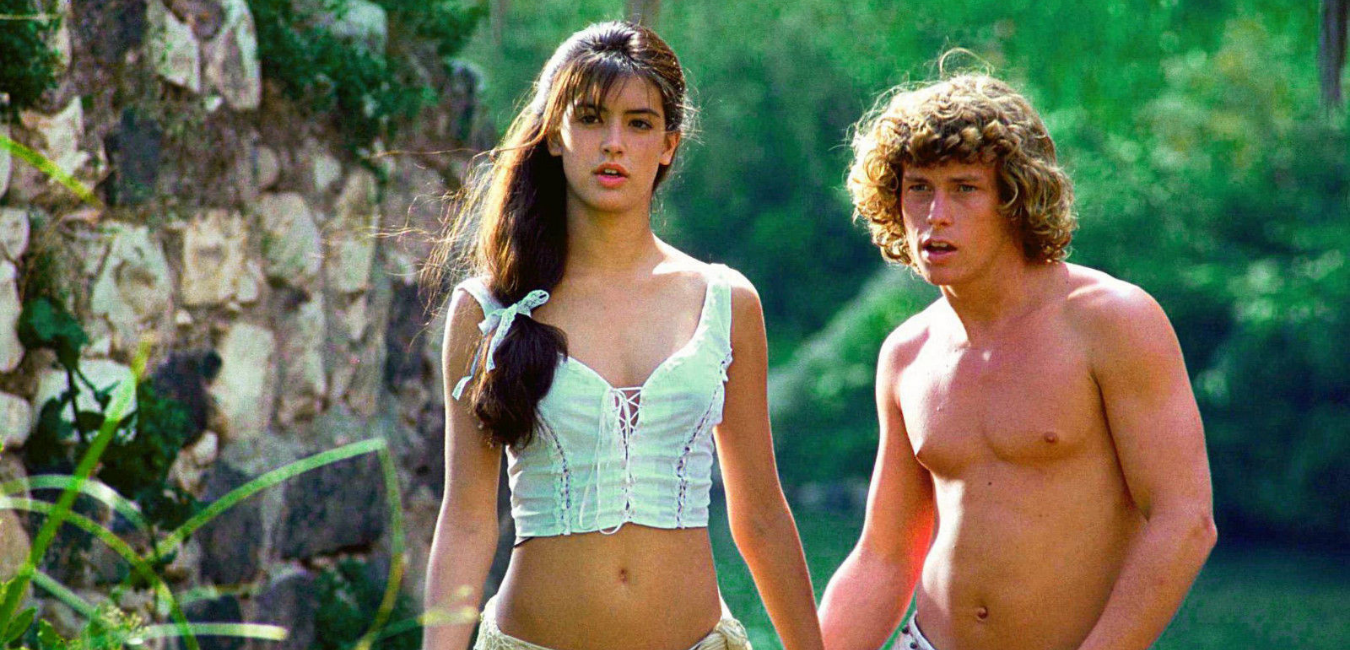 Phoebe Cates (left) and Willie Ames lose themselves (and their tops) in 1982’s “Paradise.” (Embassy Pictures/MovieStillsDB.com)