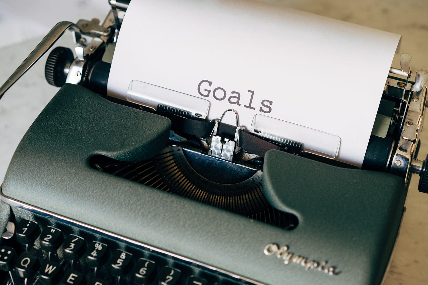 A typewriter with text that says “Goals”