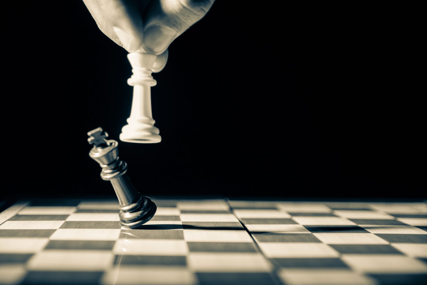 The Unexpected Power of Self-Love. A black and white picture of a chess game.