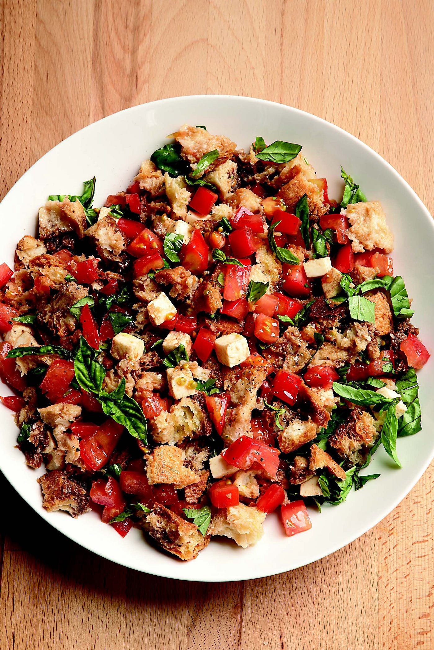 A large bowl of Tomato, Mozzarella, and Bread Salad.