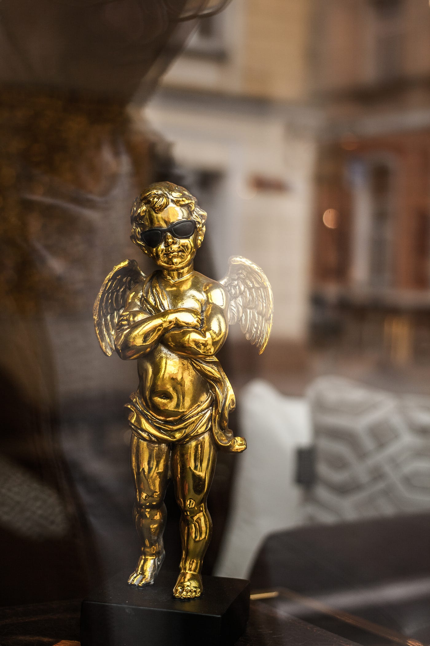 Bronze angel statute with sunglasses