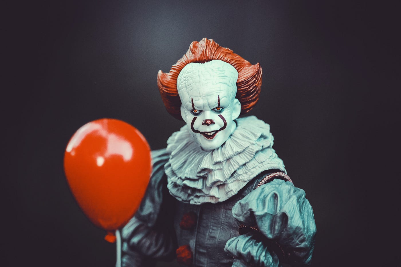 Pennywise, the dancing clown with his red balloon, is a classic pop culture horror icon, representing one of our most common fears.
