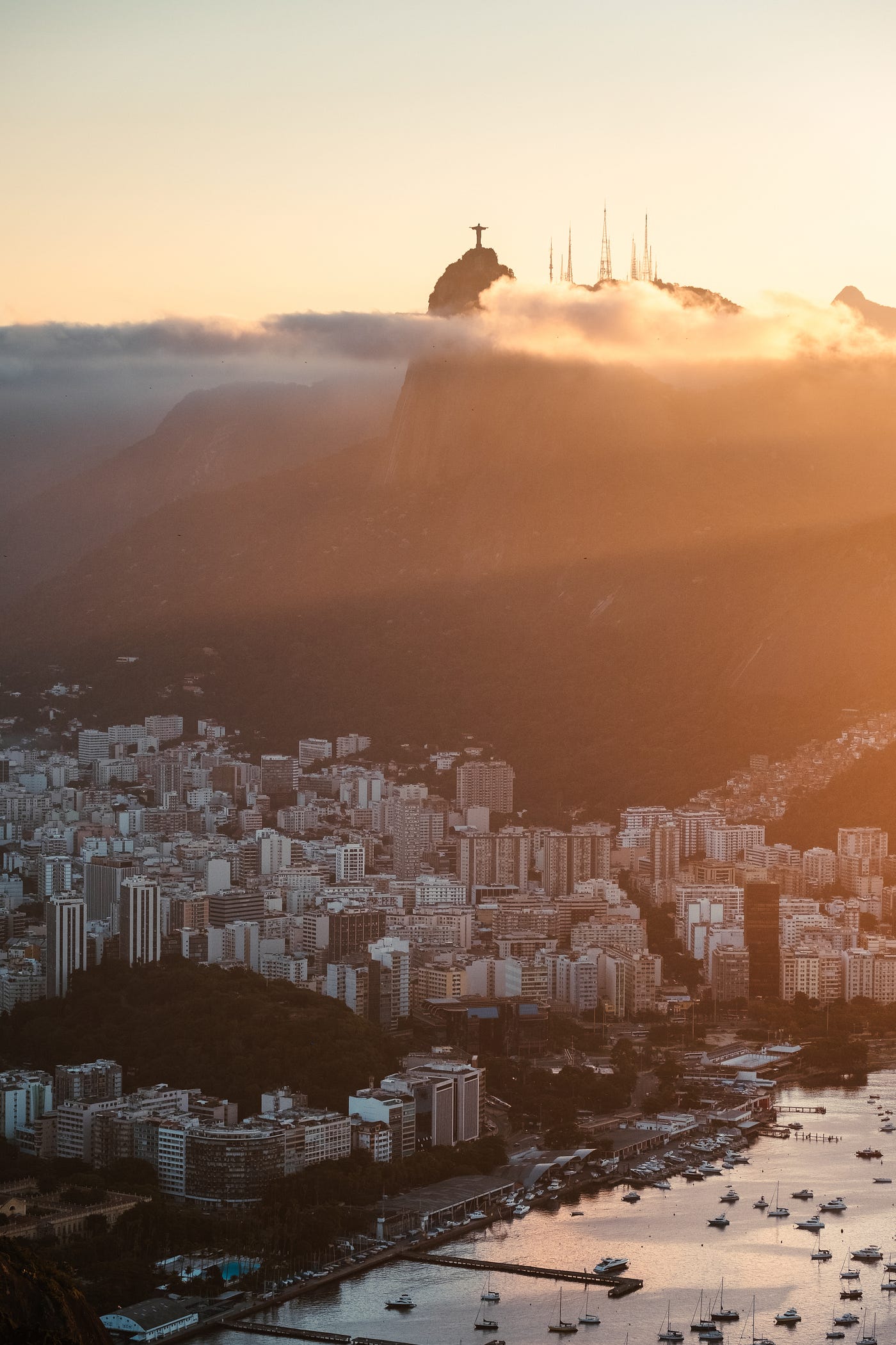 Rio de Janiero, Brazil as see from above. We see the Christ the Redeemer sculpture in the distance.