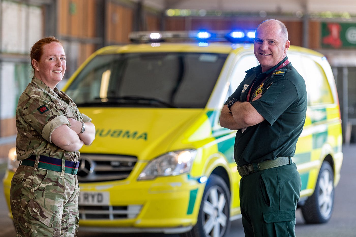 Left Corporal Tracey Llewellyn, 3rd Royal Welsh Regiment and George Smyth from Resilience Department in front of an ambulance
