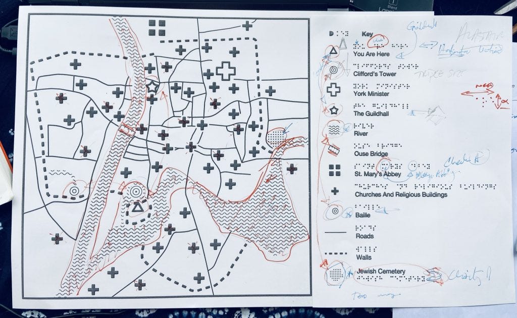 Tactile map prototype with lots of notes from usability sessions with blind people