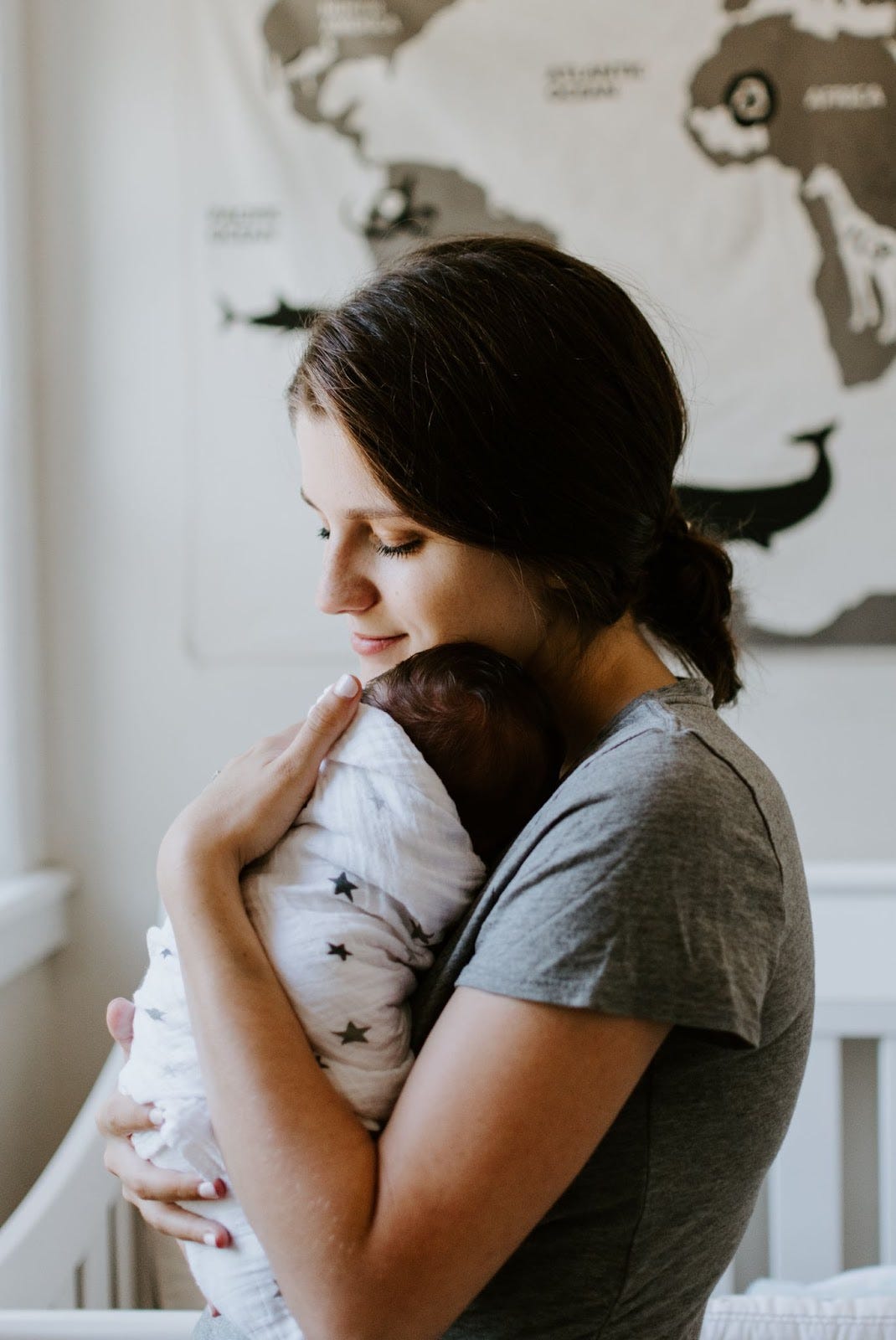 A woman holding her newborn.
