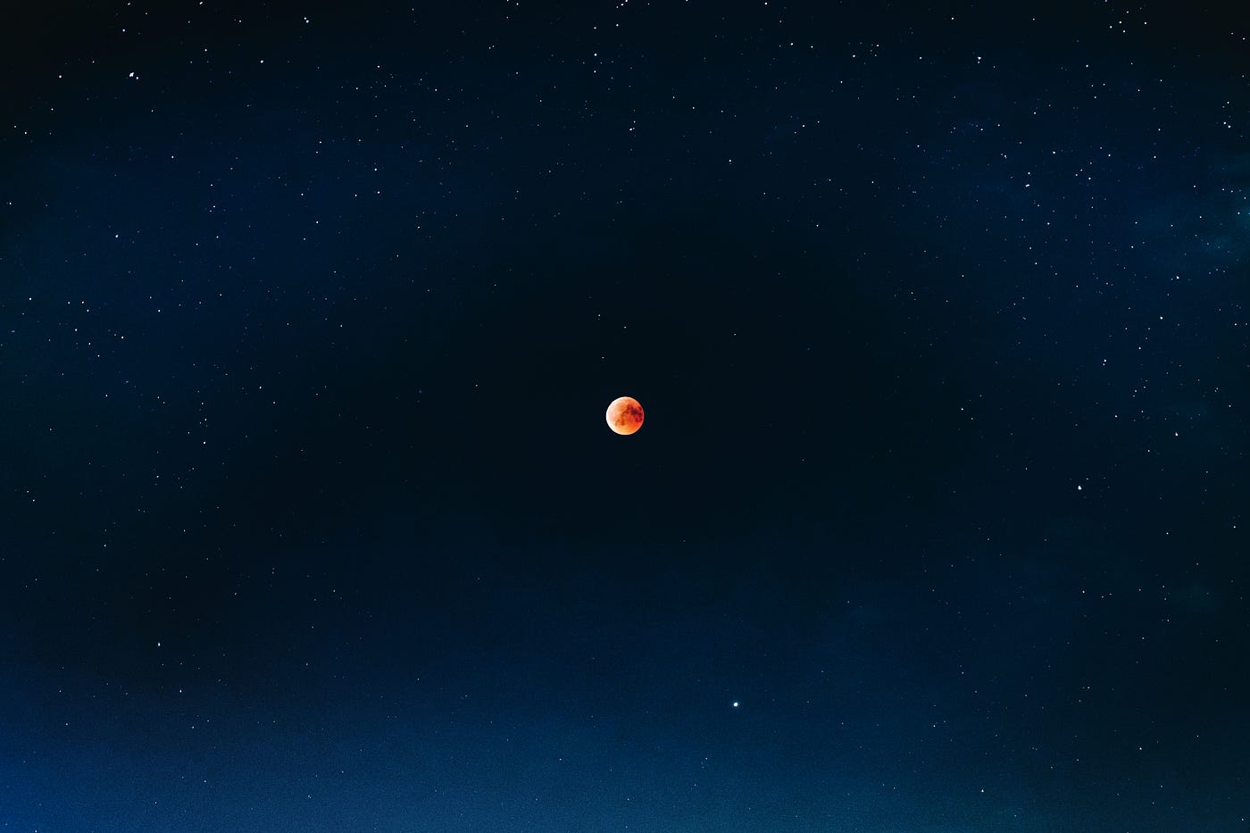 Red moon in darkness of universe