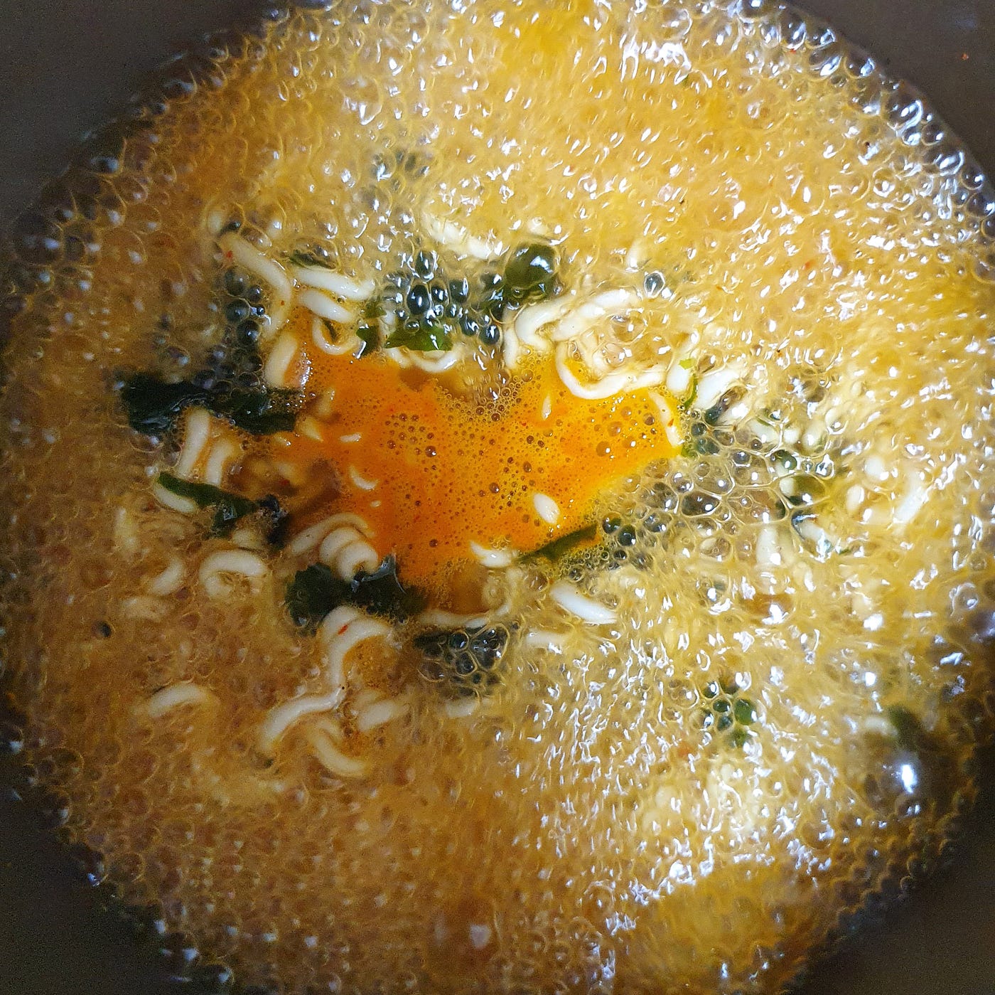 All ingredients from a package of Nongshim Neoguri Ramen added in and boiling.