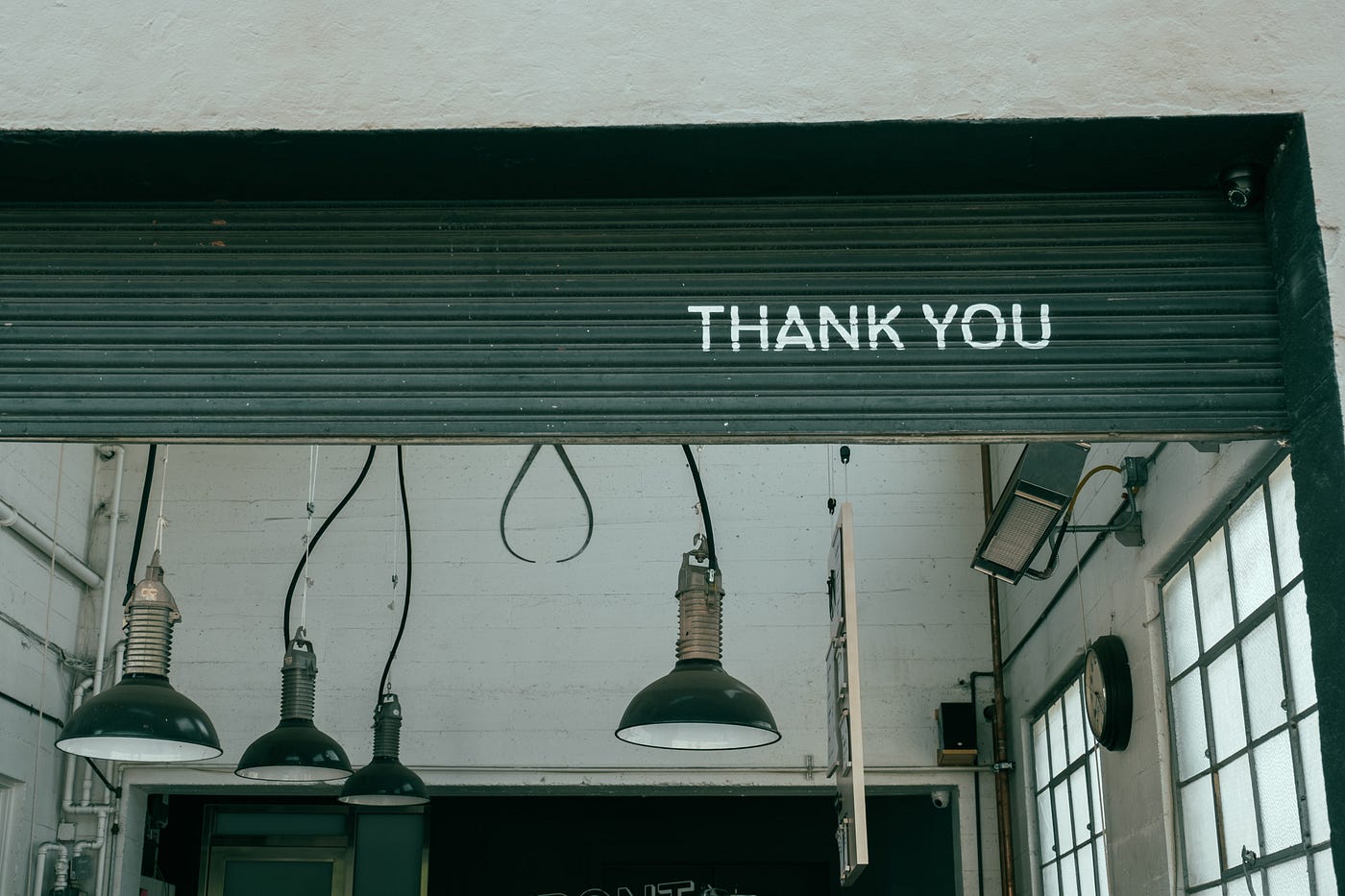 āThank Youā written on a door of a garage.