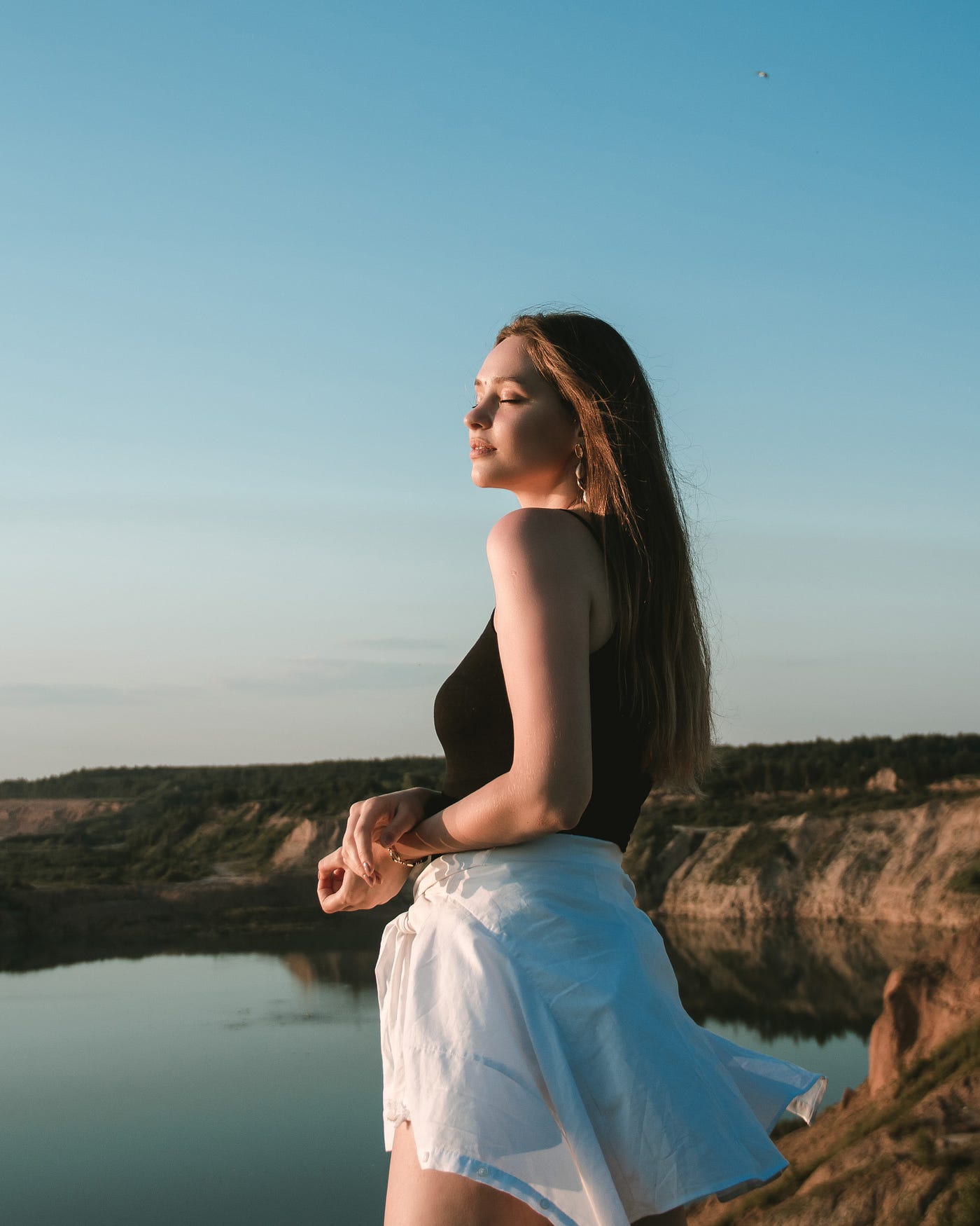 Woman enjoying the ocean breeze
