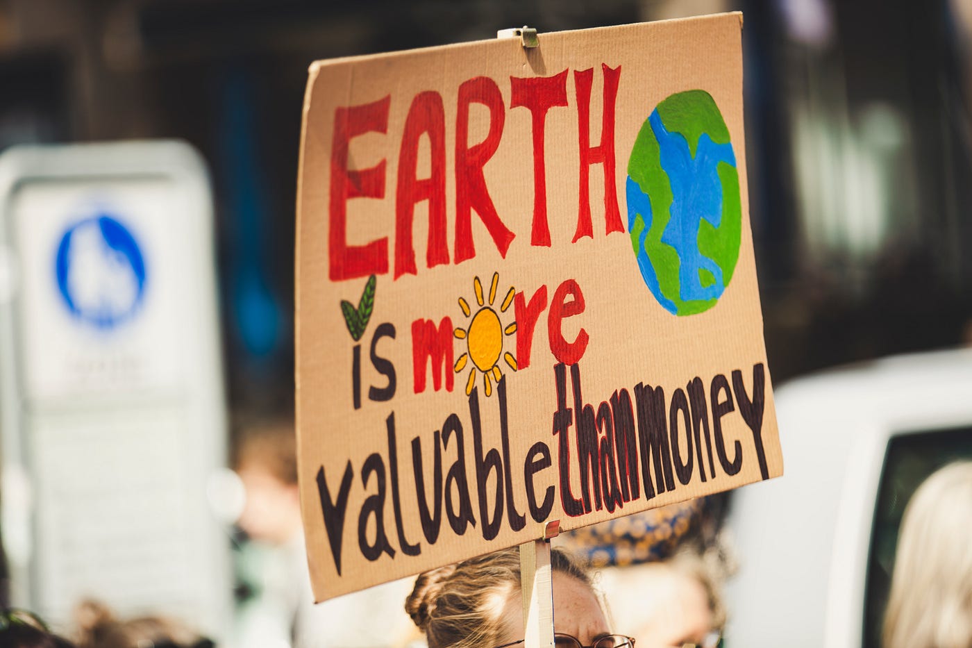 A sign that claims “Earth is more valuable than money”
