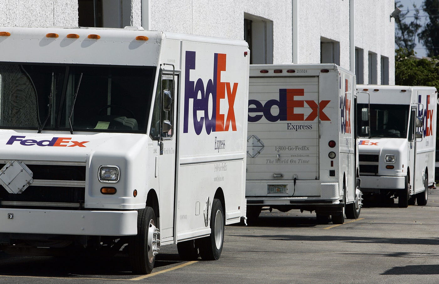 FedEx trucks lined up on a street