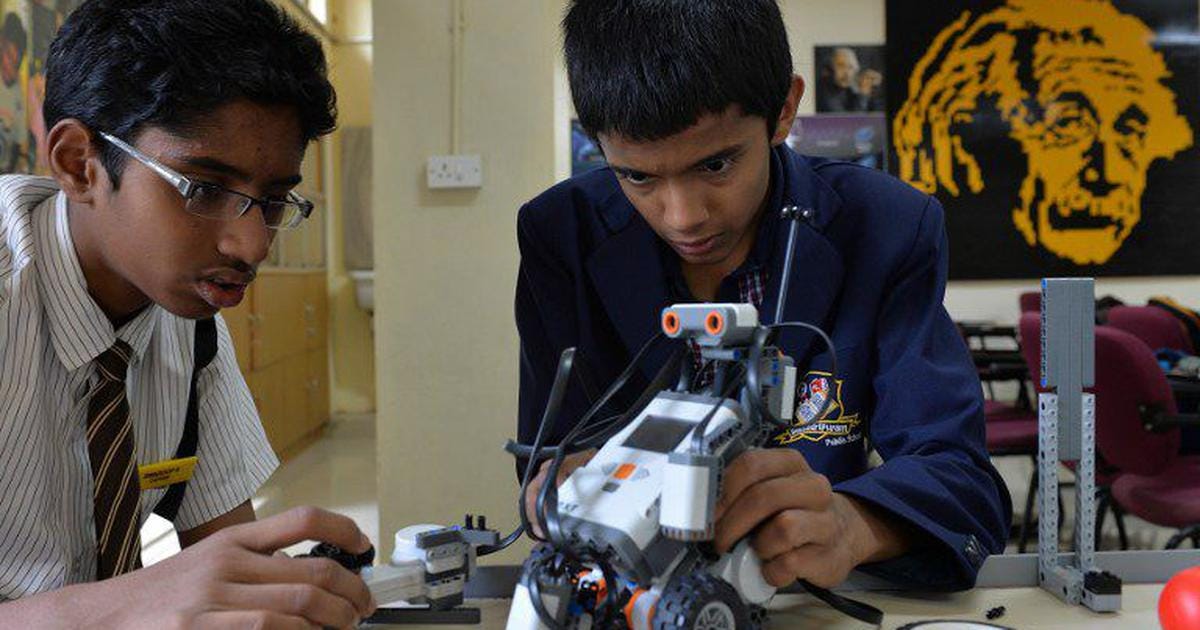 Picture of Indian school kids working on a robot
