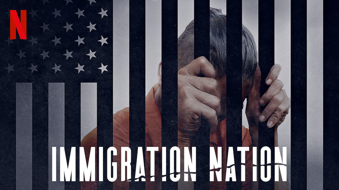 A version of the American flag overlays image of an immigrant in orange jump suit at clasping prison bars.