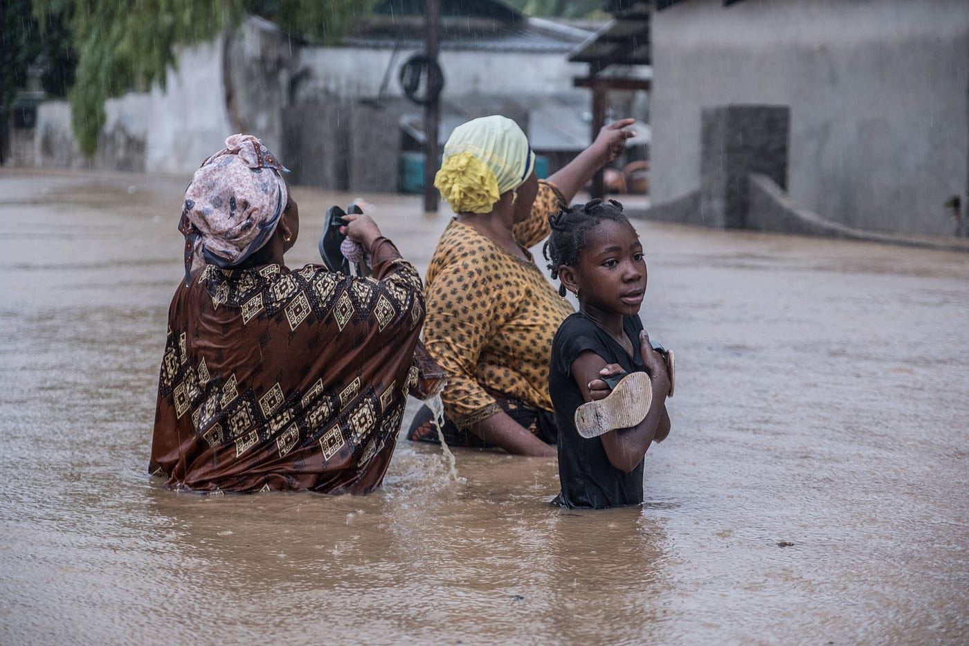 Women in waist-deep water in Pemba, Mozambique, after tropical Cyclone Kenneth. Credit: Tommy Trenchard