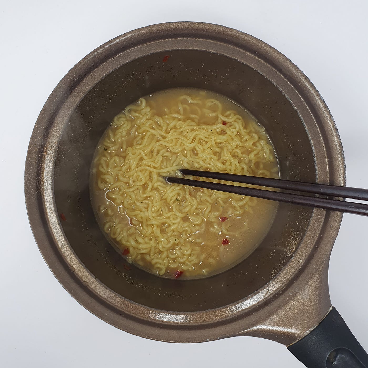 A finished pot of Wicked Ramen (Yogoe Ramyeon) Vongole Flavor still in the pot with chopsticks.