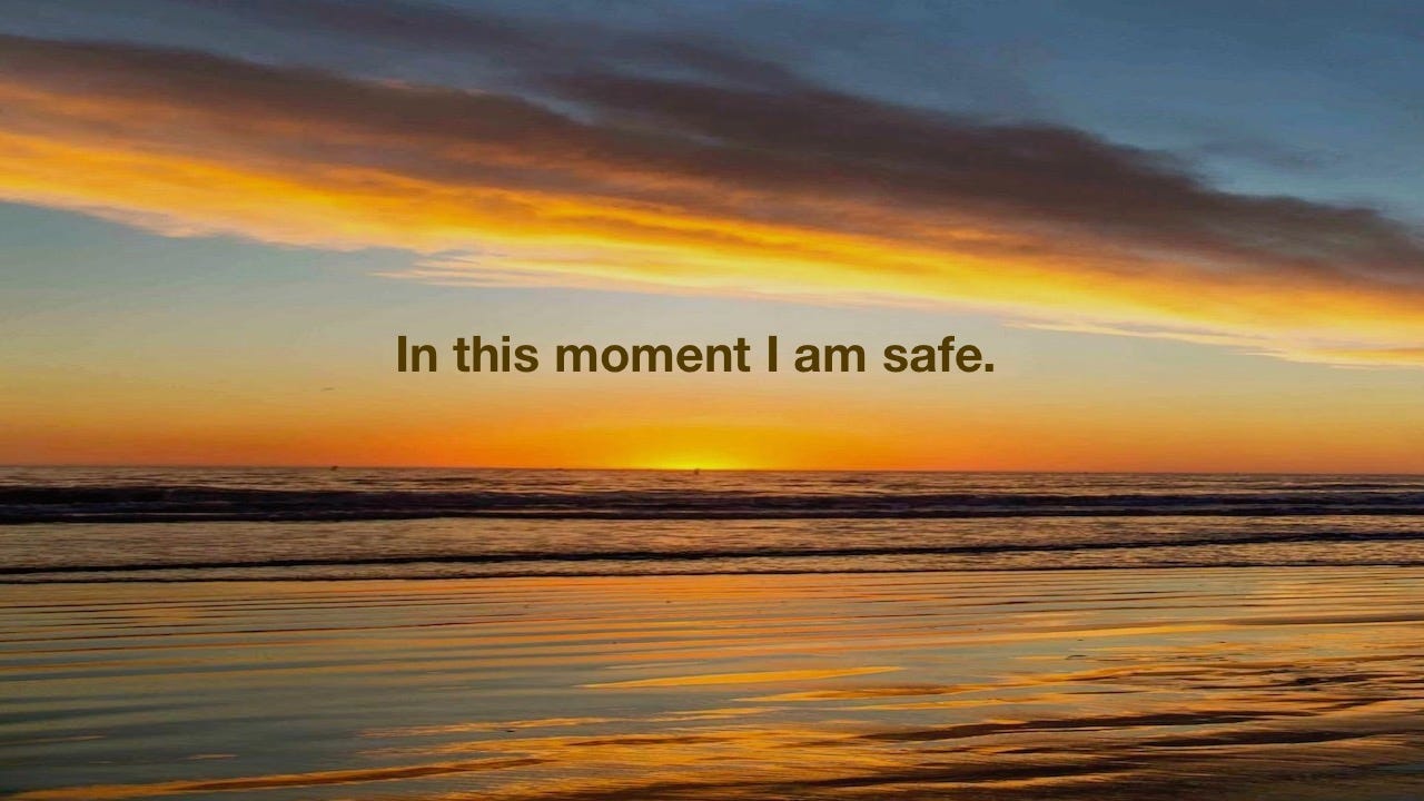 Sunset over ocean with text In this moment I am safe