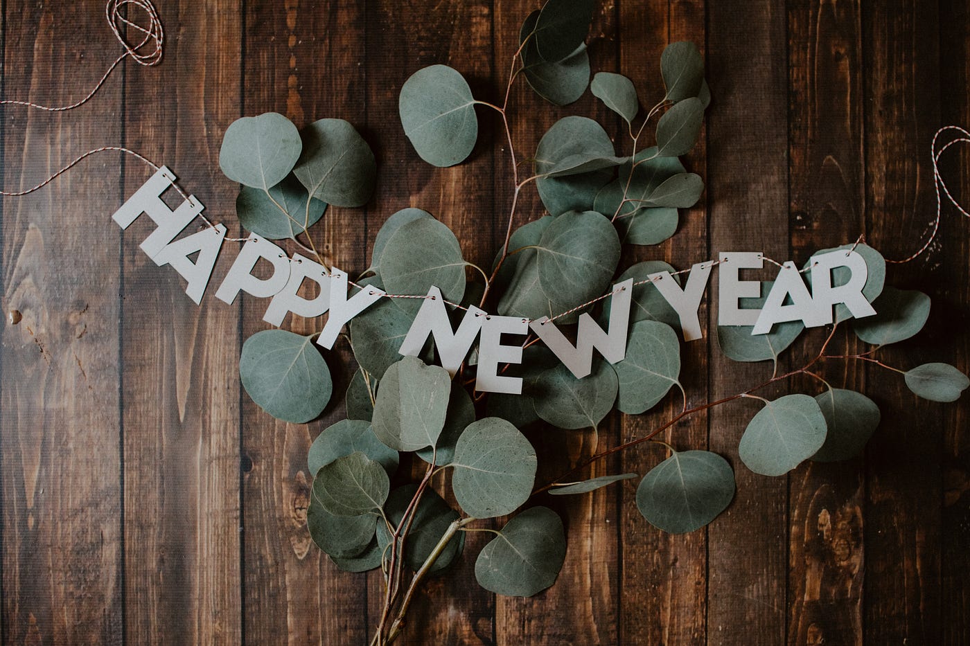 Happy New Year banner with leaves