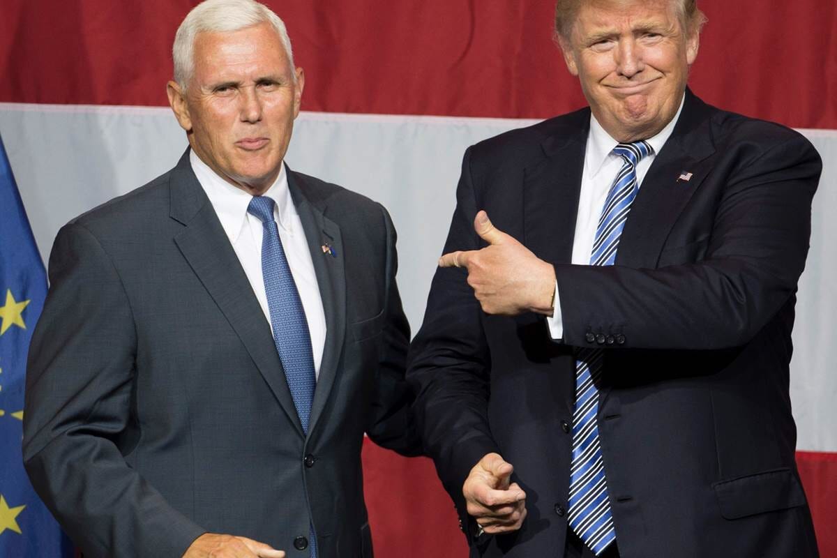 A photo of Donald Trump and Mike Pence in front of an American Flag — Photo Credits: NBC News