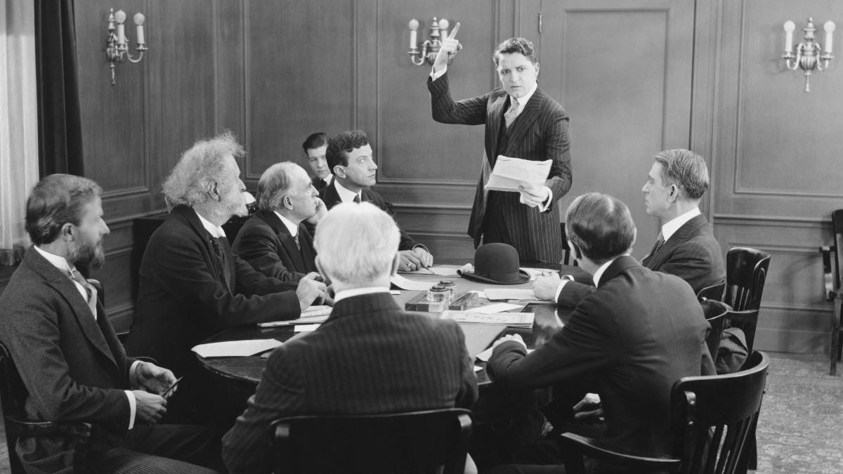 An old picture of an all-male, all-white board.