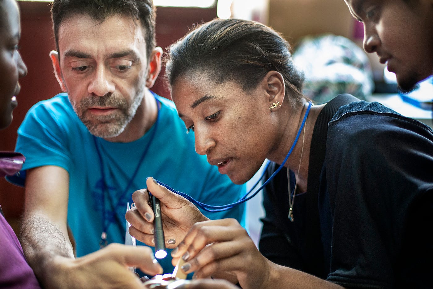 Cleft Surgeon, Fellow, Naikhoba Munabi of the US, Cleft Surgeon Luca Autelitano of Italy evaluates a patient with me during a