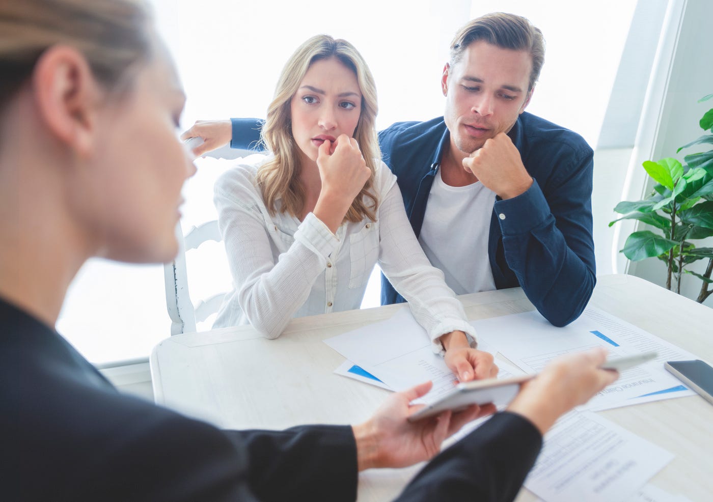 Couple reviewing a contract.