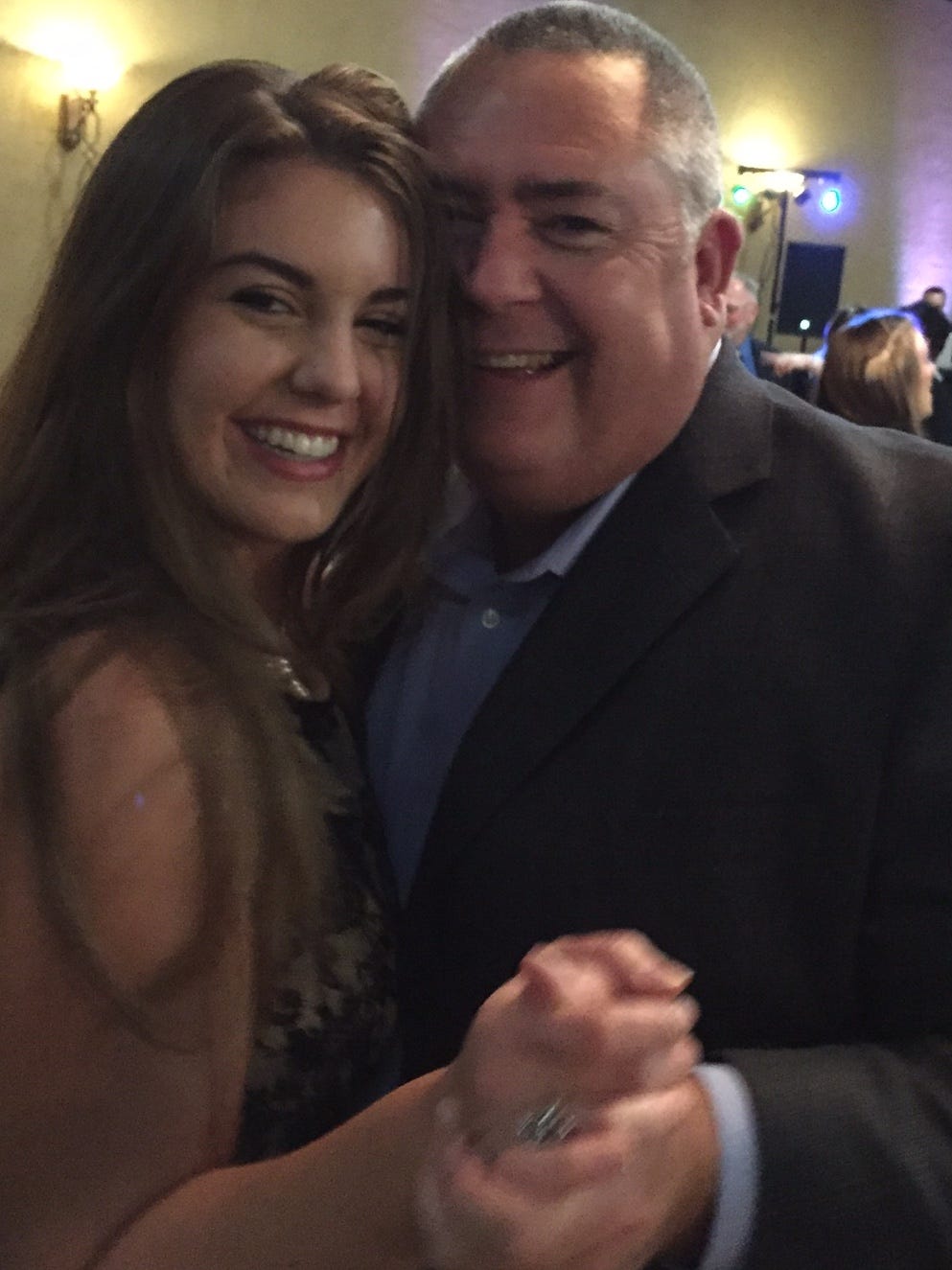 The author and her dad, dancing at a wedding