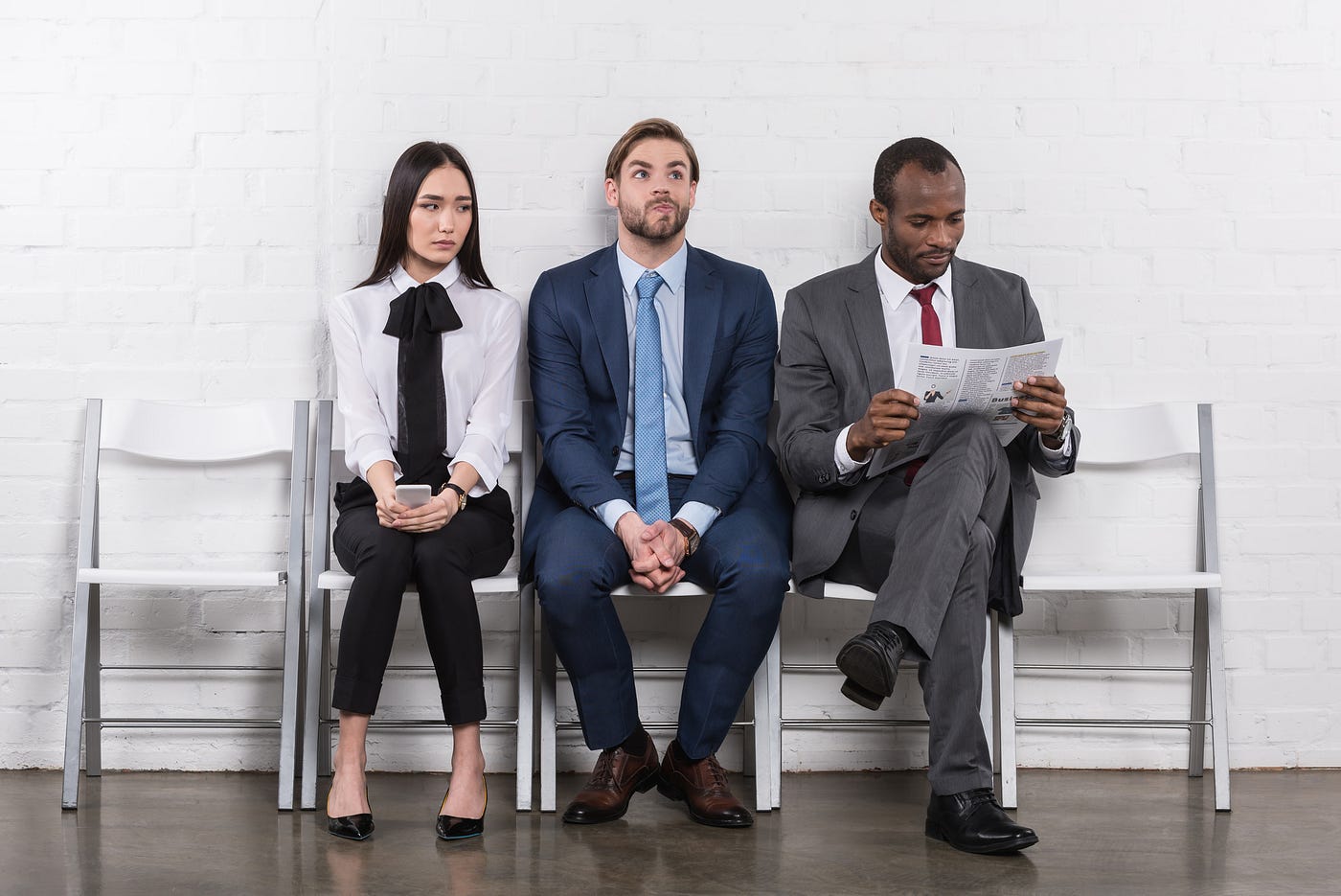 Source: https://depositphotos.com/184229582/stock-photo-multiethnic-young-business-people-waiting.html