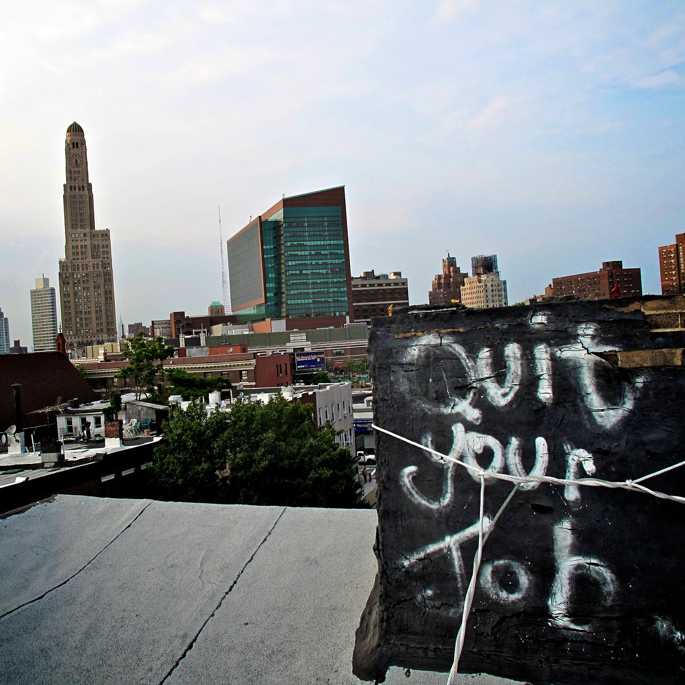 Quit Your Job sign in forefront of city