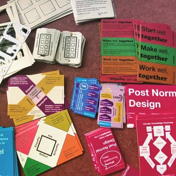 A selection of workshop cards spread on the floor