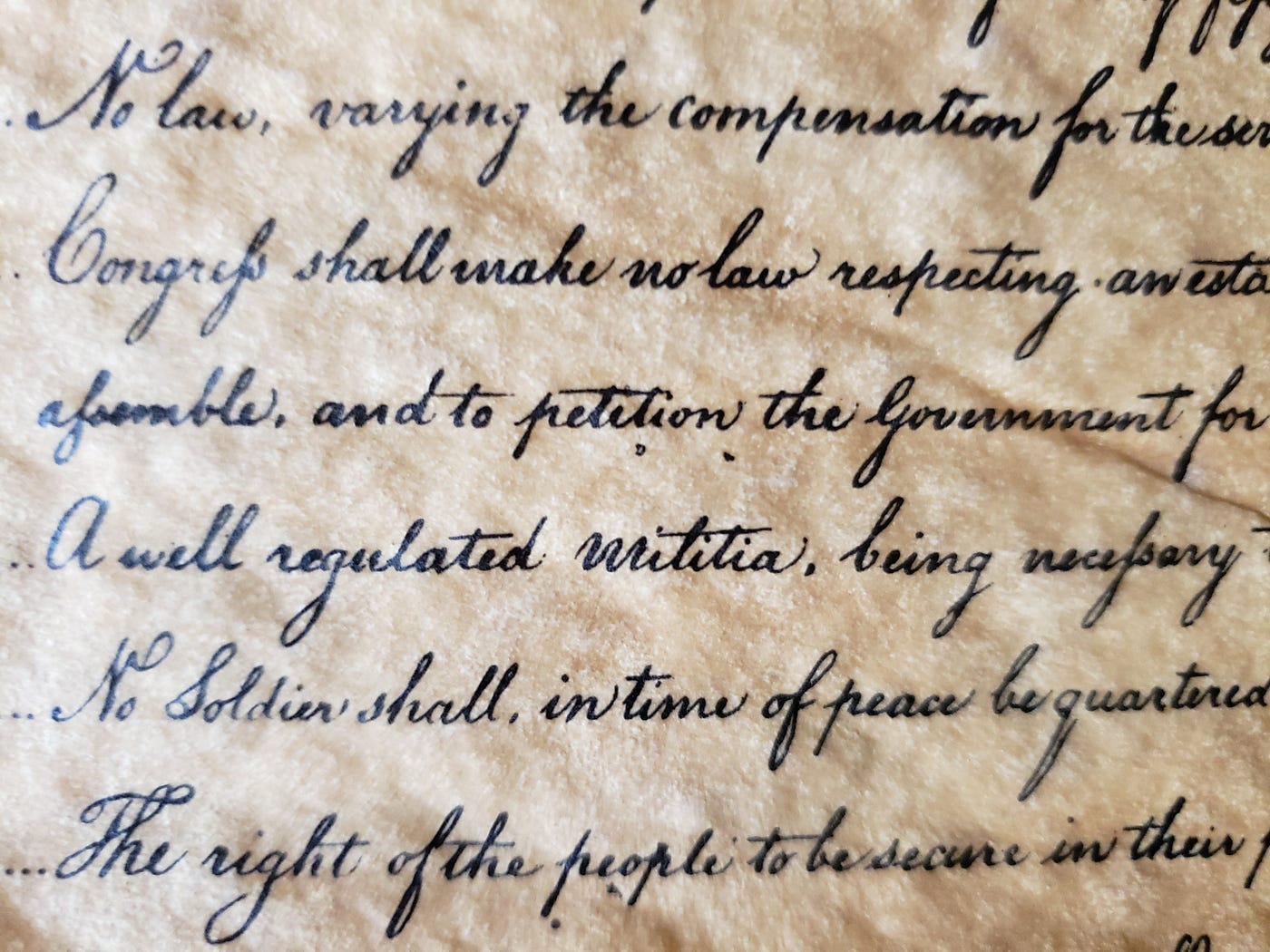 Closeup photo of scripted text of the Bill of Rights