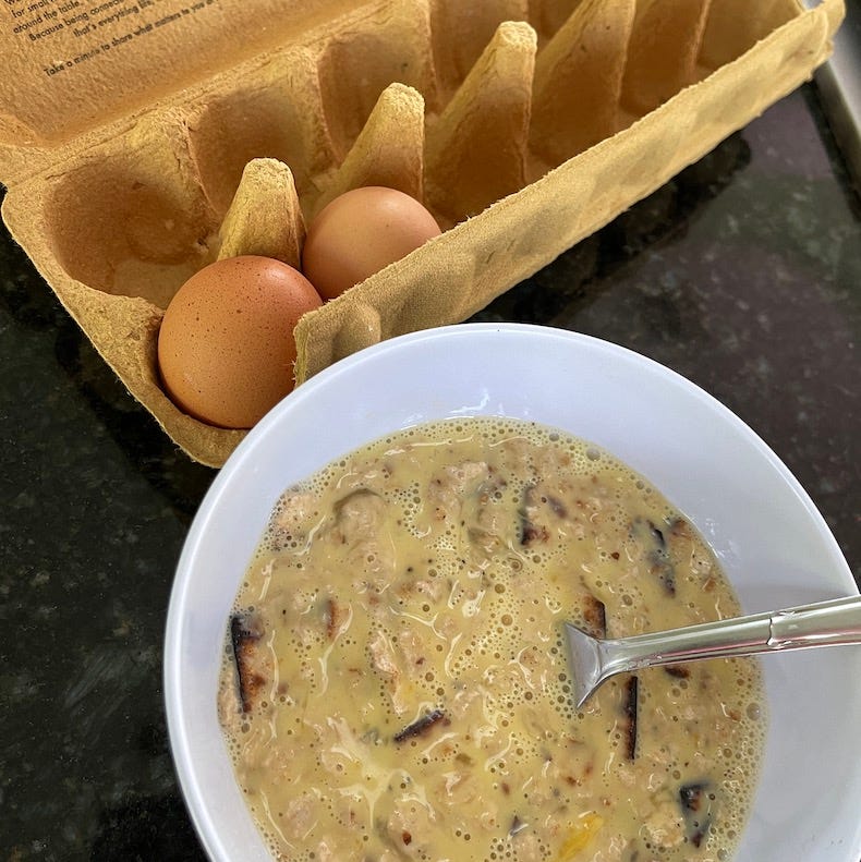 Soaked and drained matzos now combined with egg mixture in one bowl.