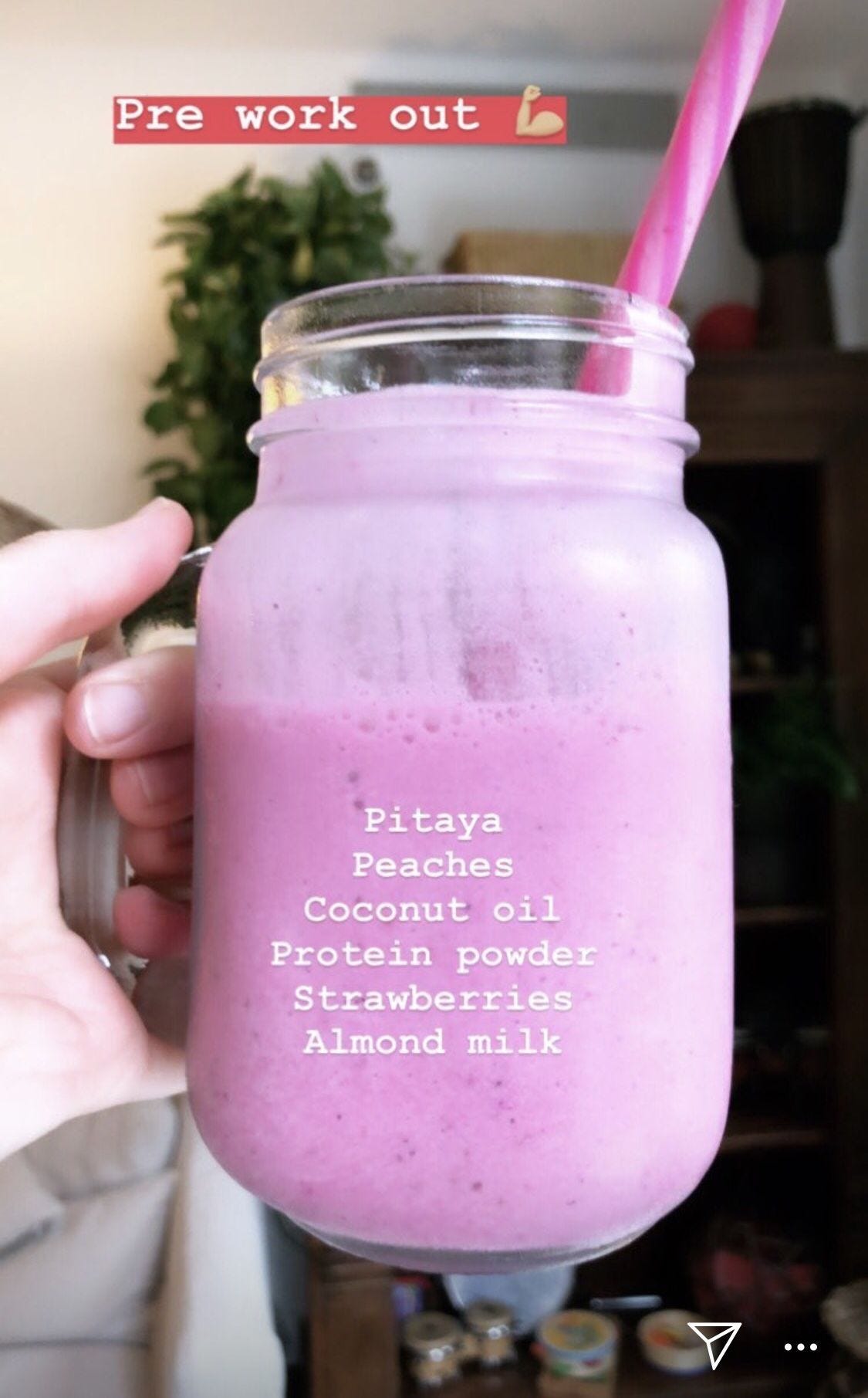 A protein smoothie made with Pitaya, peaches, coconut oil, protein shake, strawberries, almond milk.